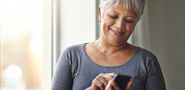 Woman dialing number on phone