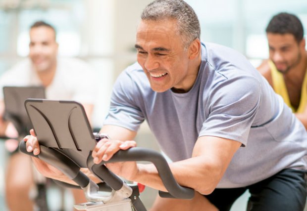 Man cycling on stationary bike